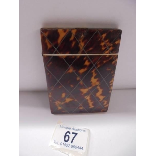 67 - A tortoiseshell card case.