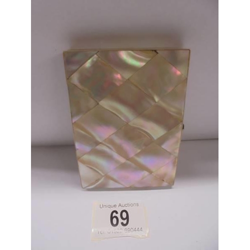 69 - A mother of pearl card case with silver cartouche.