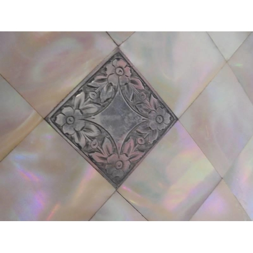 69 - A mother of pearl card case with silver cartouche.