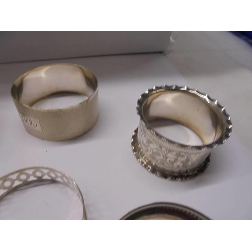 127 - Eight hall marked silver napkin rings, 90 grams.