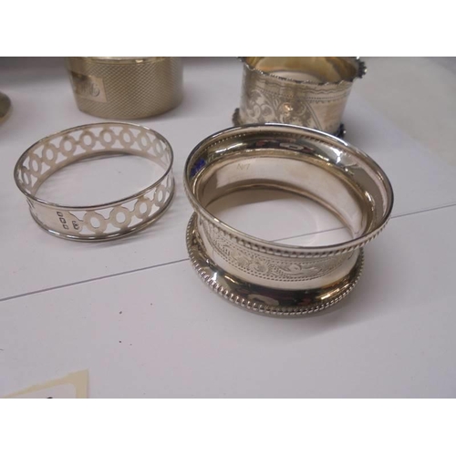 127 - Eight hall marked silver napkin rings, 90 grams.