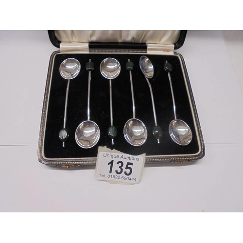 135 - A cased set of six silver coffee spoons, 36 grams.