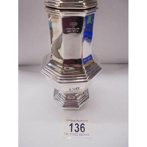 136 - A silver sugar sifter, 21 cm tall, 8 ounces.