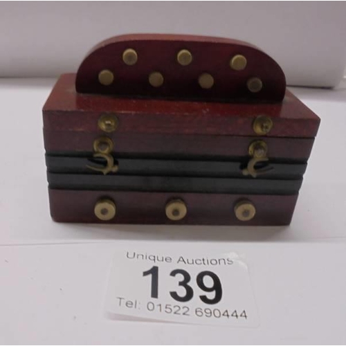 139 - A set of miniature dominoes.