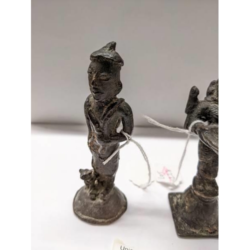 201 - Two oriental bronze figures, 10cm and 12cm.