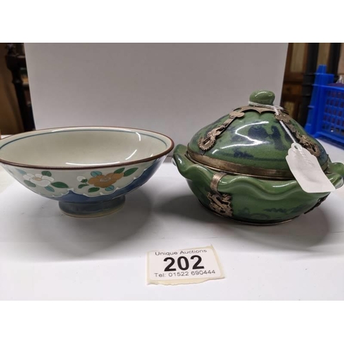 202 - A Chinese lidded teabowl with metal fittings and another Chinese tea bowl.