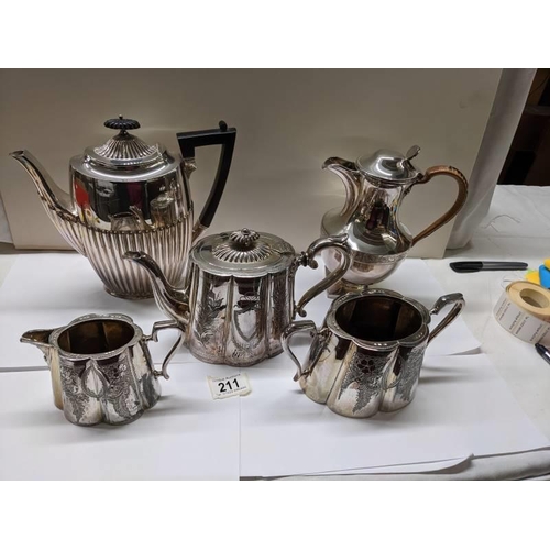 211 - A three piece silver plate tea set, coffee pot and water jug.