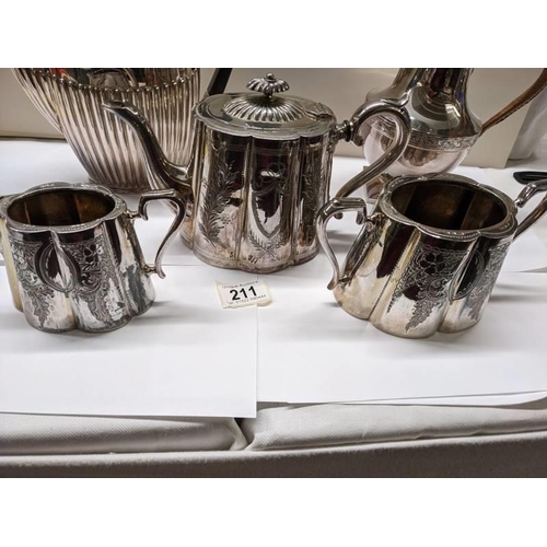 211 - A three piece silver plate tea set, coffee pot and water jug.