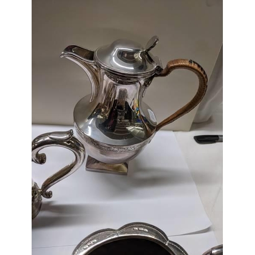 211 - A three piece silver plate tea set, coffee pot and water jug.