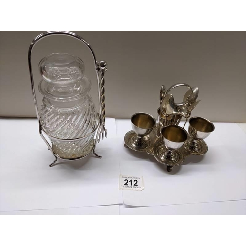 212 - A silver plate egg cup stand and a pickle jar on silver plate stand.