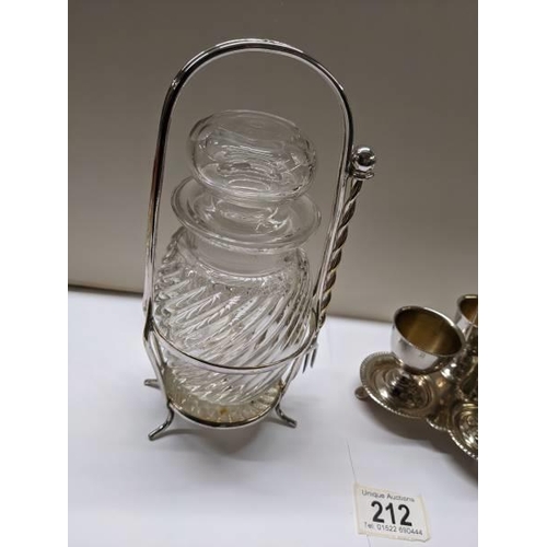 212 - A silver plate egg cup stand and a pickle jar on silver plate stand.