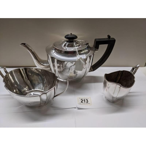 213 - A three piece silver plate tea set.