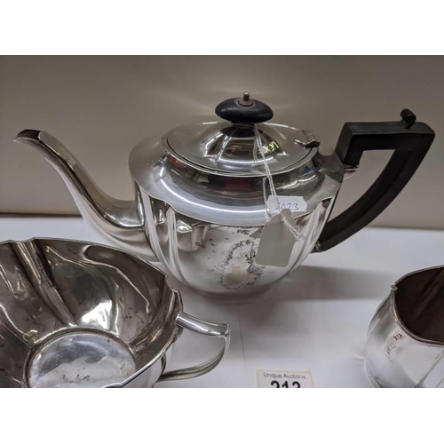 213 - A three piece silver plate tea set.