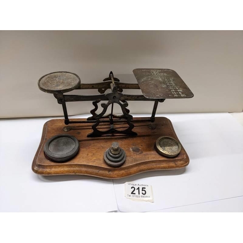 215 - A set of Victorian brass postal scales with weights,