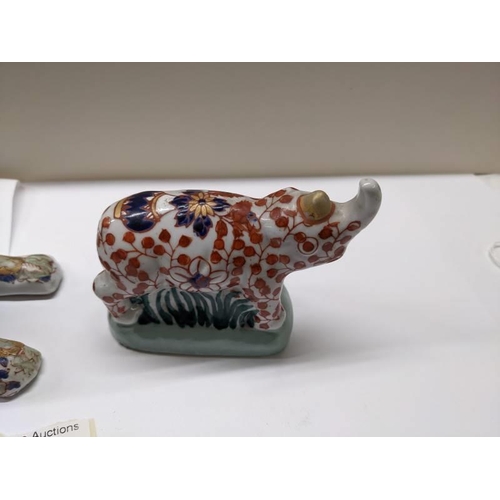 216 - Two signed Imari animals being a dog and rare rhino (Ya You Zhen).