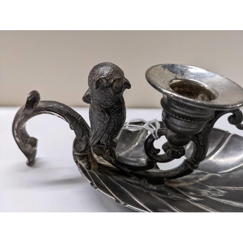 228 - A 19th century silver plated vesta of an owl sitting on a chamber candlestick.