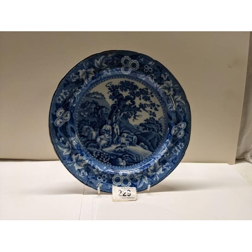 229 - A late 19th century soft paste blue and white Delft style plate.