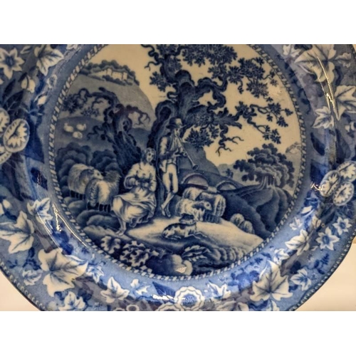 229 - A late 19th century soft paste blue and white Delft style plate.