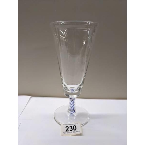 230 - An early stemmed glass with blue twist stem.