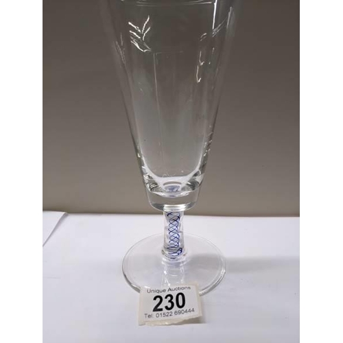 230 - An early stemmed glass with blue twist stem.