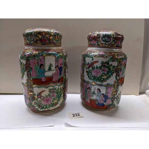 232 - A pair of large Cantonese Famille Rose lidded ginger jars, 25.5 cm tall.