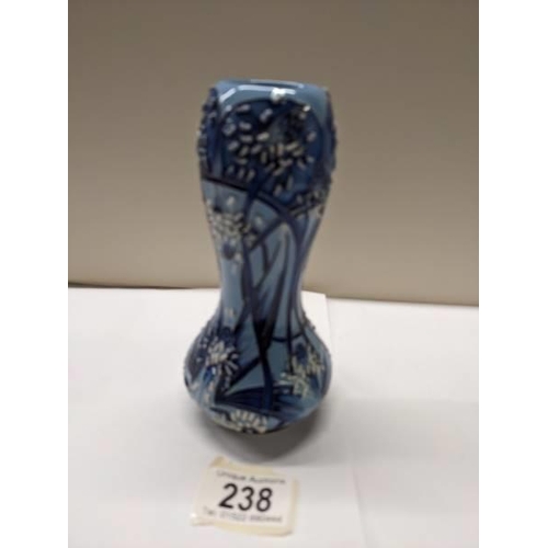 238 - A 2002 Moorcroft florian style vase by Emma Bossuns.