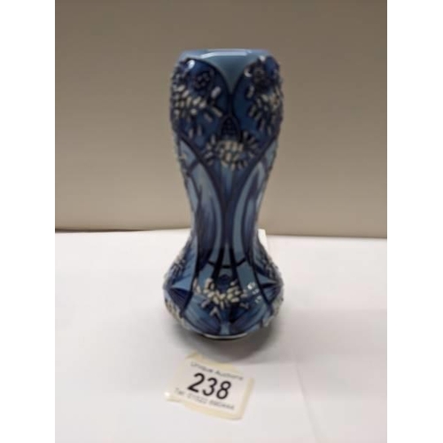 238 - A 2002 Moorcroft florian style vase by Emma Bossuns.