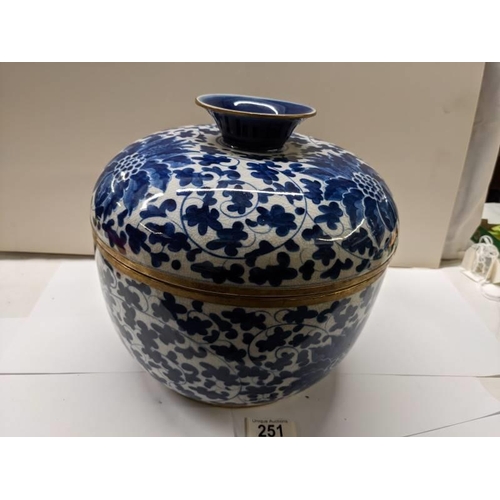 251 - A large Chinese lidded pot with metal fittings, Shun-Chih.