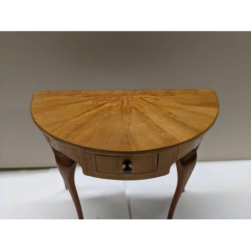 252 - An apprentice piece 'D' shaped inlaid table.