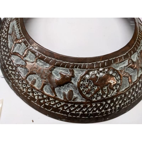 257 - Two African neck decorations in copper with engraved animals.