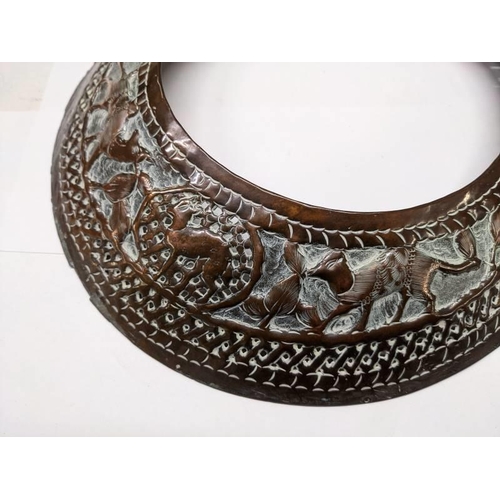 257 - Two African neck decorations in copper with engraved animals.