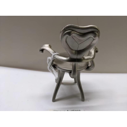 260 - A 1/6 scale white metal model of a Battlo chair by Antoni Gaudi.