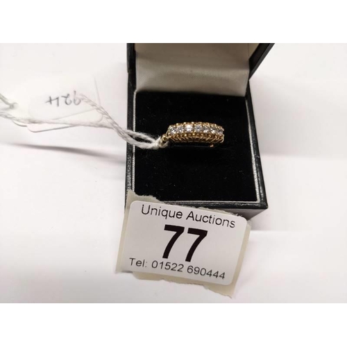 77 - A 9ct gold seven stone ring, size Q. 2.6 grams.