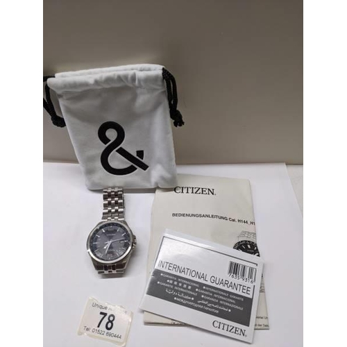 78 - A Citizen Eco-Drive radio controlled world time wrist watch with extra links and instructions in Ger... 