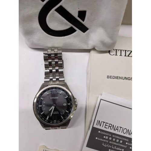 78 - A Citizen Eco-Drive radio controlled world time wrist watch with extra links and instructions in Ger... 