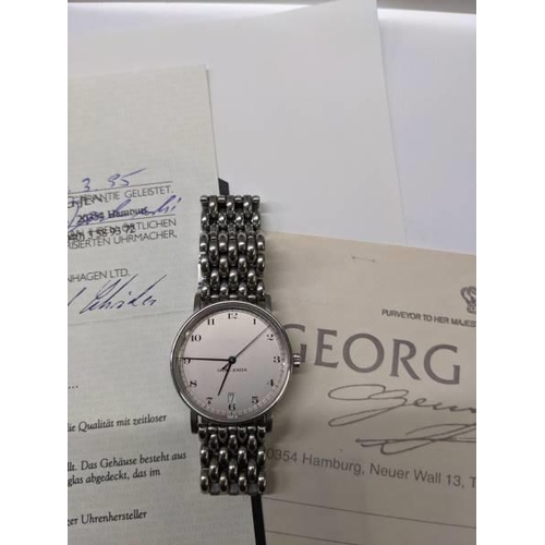 79 - A Georg Jensen automatic gents wrist watch with receipt and guarantee, dated 1995 in German.