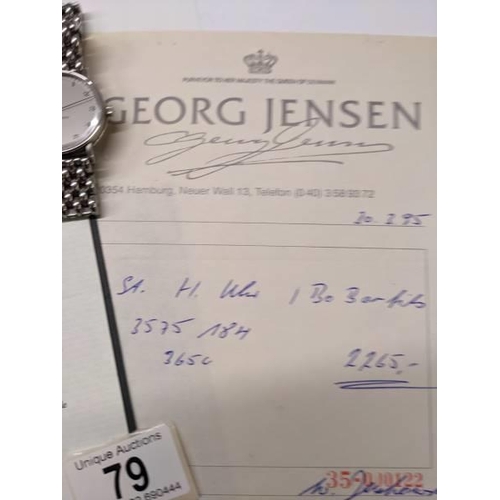 79 - A Georg Jensen automatic gents wrist watch with receipt and guarantee, dated 1995 in German.