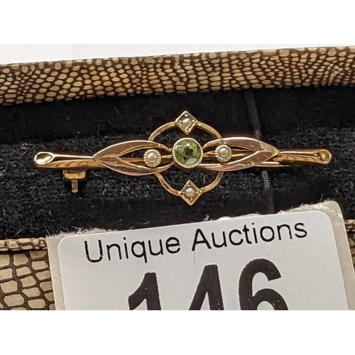 146 - An antique brooch stamped Chester, 15ct gold set peridot.