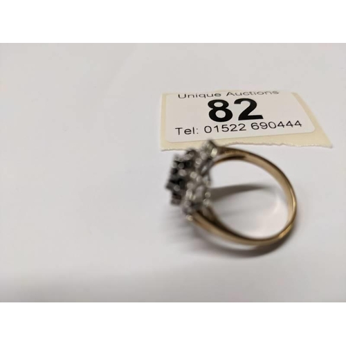 82 - A diamond and sapphire cluster ring in 9ct gold, size M, 3.8 grams.