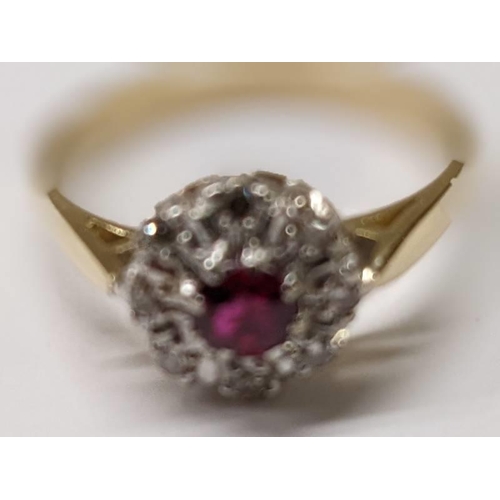 83 - A ruby and diamond cluster ring, hall marked for London 1965, 18ct gold, size M, 3.1 grams.