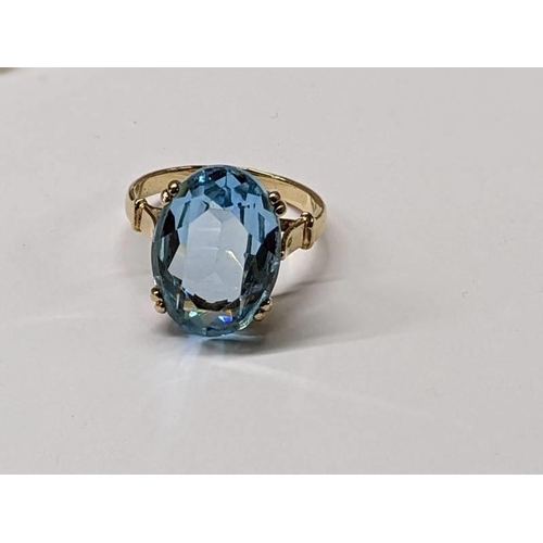 86 - A 9ct gold ring set large topaz, size R half, 5.6 grams.