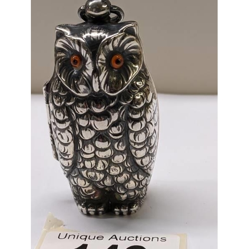 149 - A silver plated owl sovereign case.