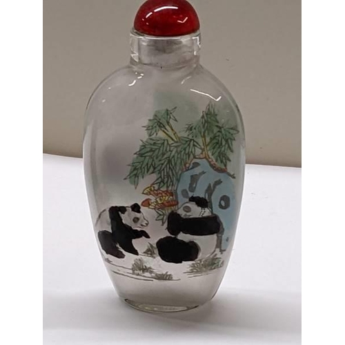 150 - A Chinese perfume bottle hand painted with pandas and another Chinese perfume bottle.