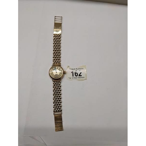 162 - A 9ct gold Omega wrist watch on a 9ct gold bracelet, in working order, total weight 49.4 grams.