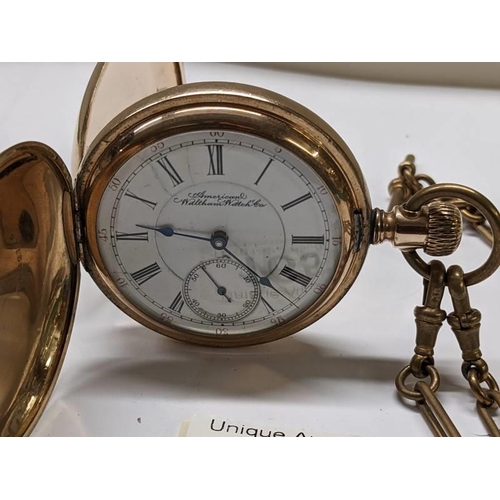 165 - A gold plated full hunter pocket watch on brass chain by American Waltham Watch Co.,