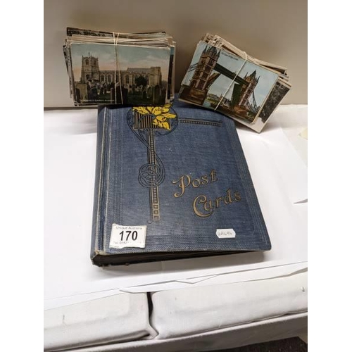 170 - A post card album and loose bundles of post cards.