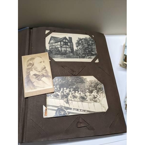 170 - A post card album and loose bundles of post cards.