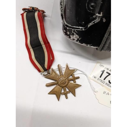 173 - A german long service medal with ribbon and bar together with a water bottle.