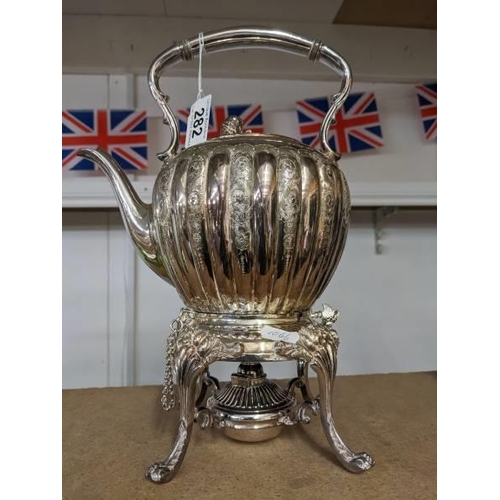 282 - A good quality silver plate kettle on stand complete with burner.