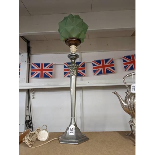 283 - An art deco table lamp with green glass shade.